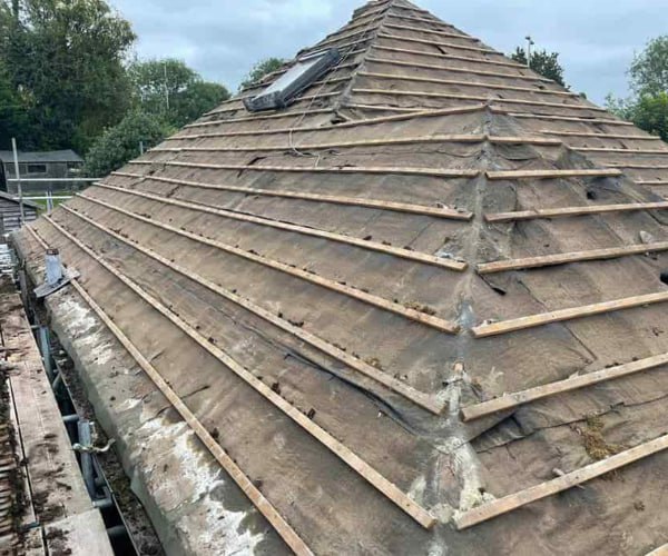 This is a photo of a hip roof that has been stripped back to the battens, and is awaiting a new roof covering to be installed. Works carried out by LPO Roofing Kempston